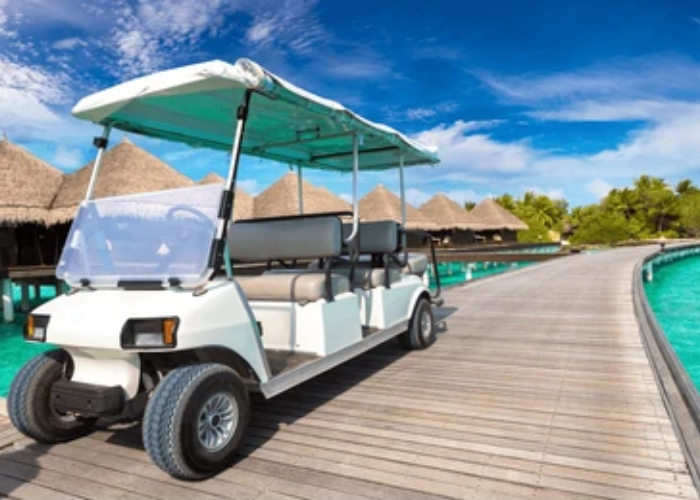 electric golf cart boarding and ride comfort check on resort guest route