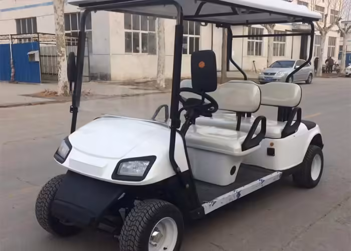 reserve electric golf carts staged with charge labels for backup fleet rotation